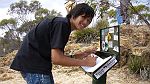 26-Japanese exchange student (Hiroaki) signs the visitors book at Milmed Rock